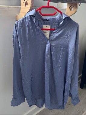 Blue button up shirt with a relaxed fit